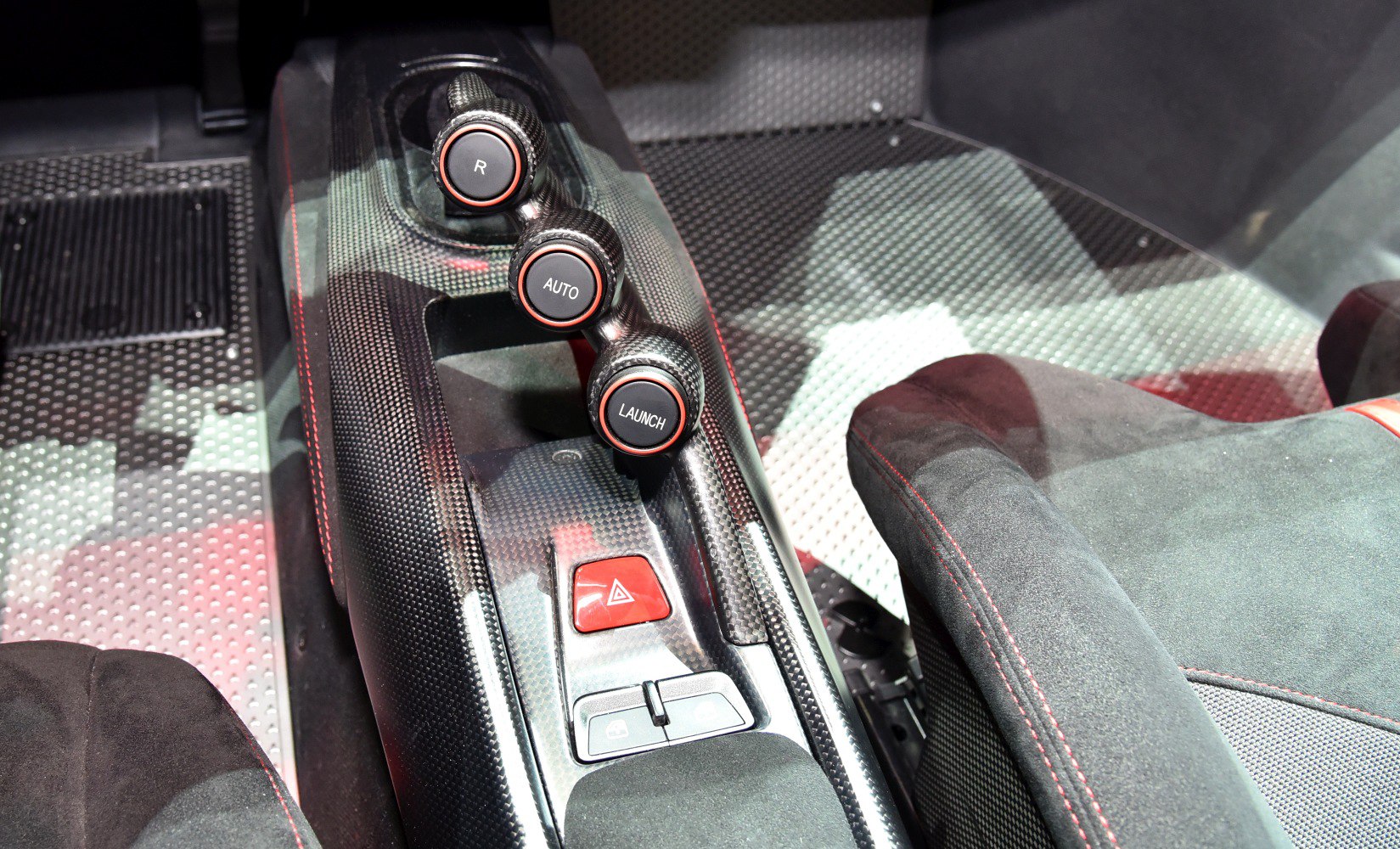 Carbon fiber center console with R, Auto, and Launch buttons