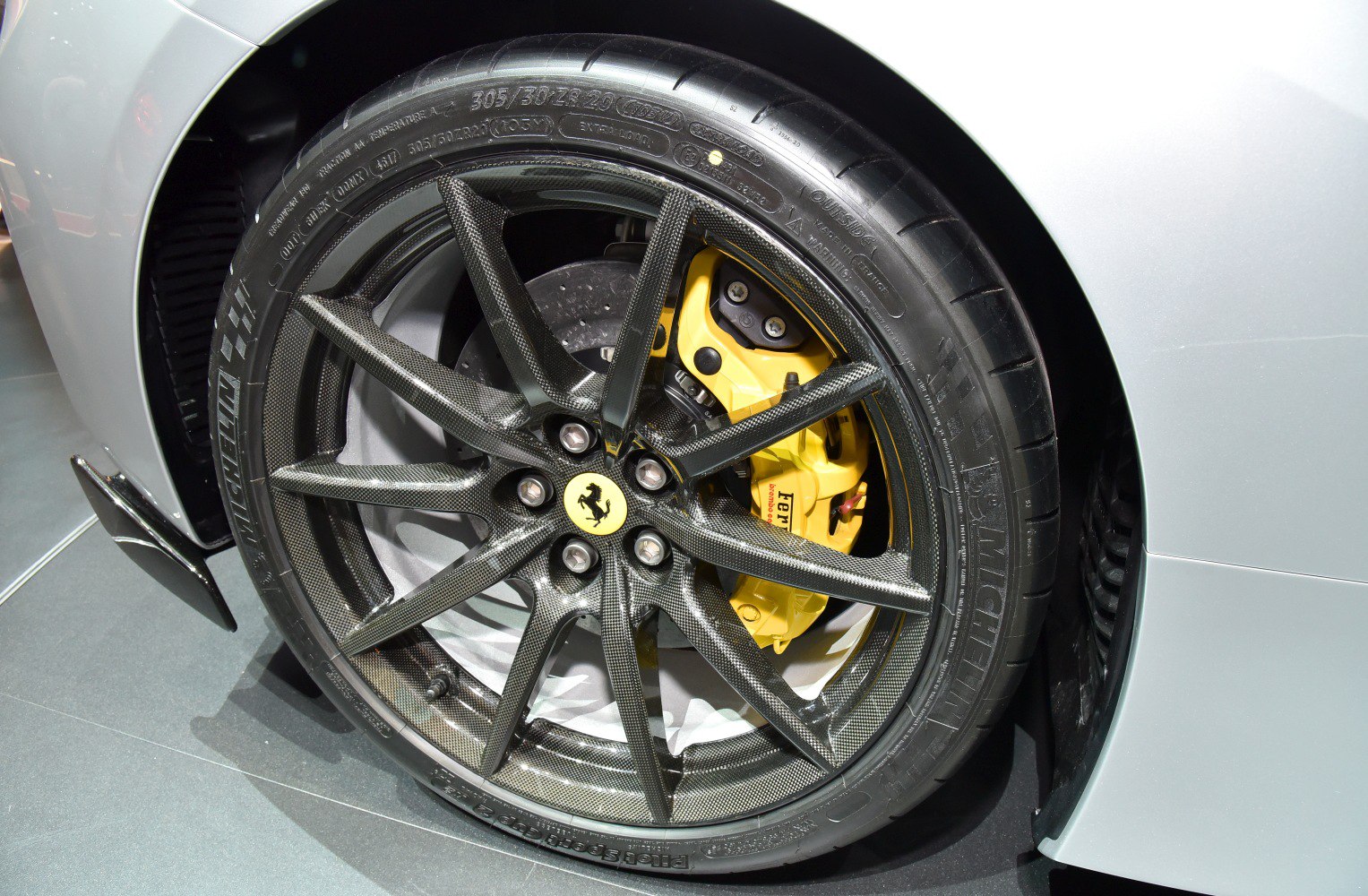 Carbon fiber wheel and yellow Brembo brake caliper
