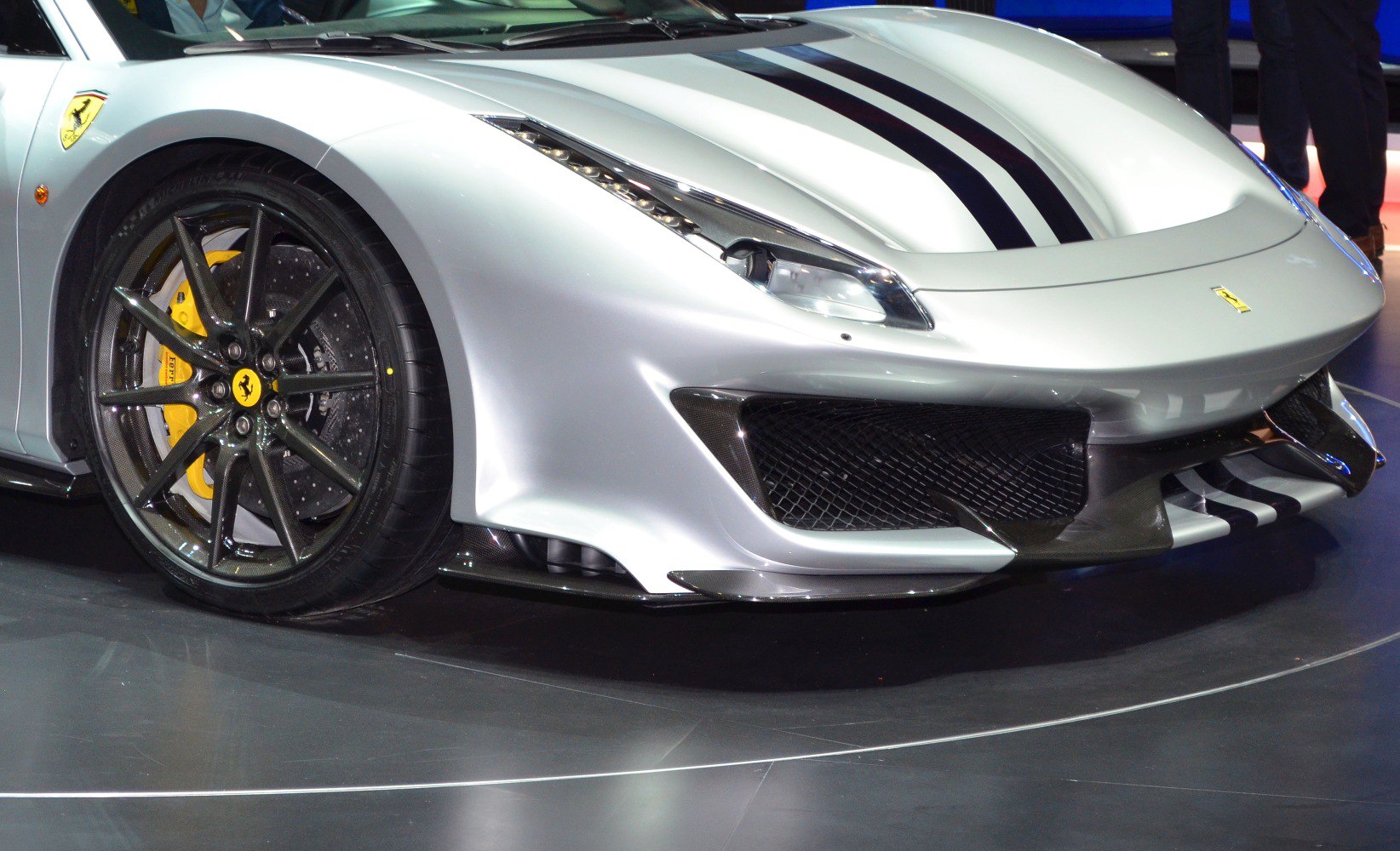 Front view with racing stripes, carbon fiber intake, and performance wheel
