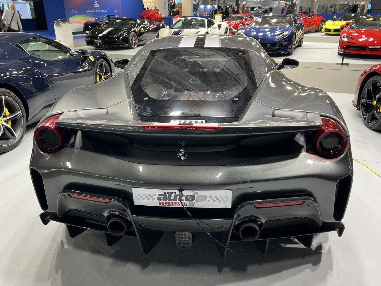 Rear design with round taillights and dual exhaust pipes on a sleek sports car