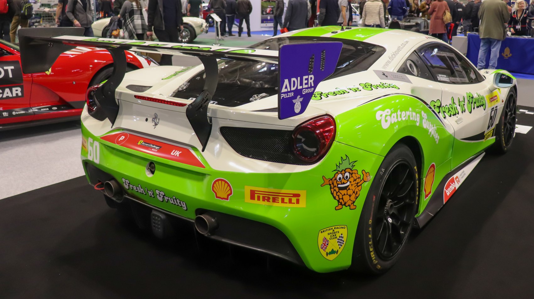 Racing rear wing and sponsor decals on race car