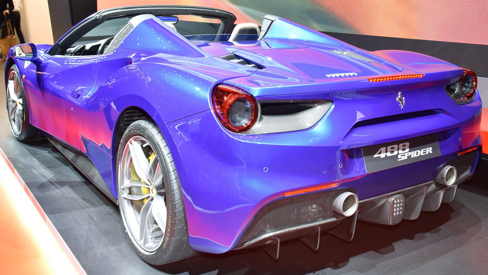 Rear sports car view with aerodynamic diffuser and dual exhaust pipes