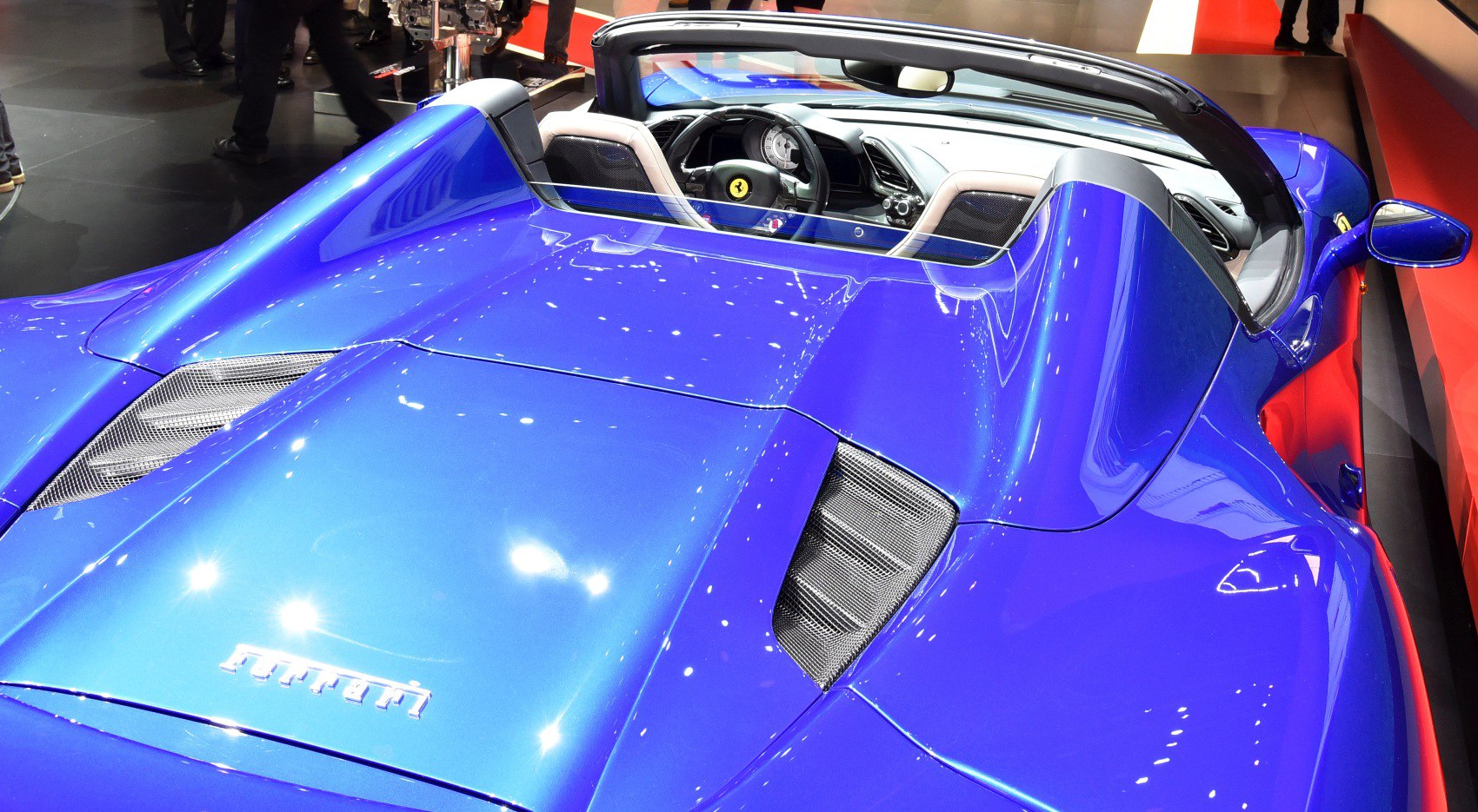 Blue convertible sports car rear and cockpit interior view