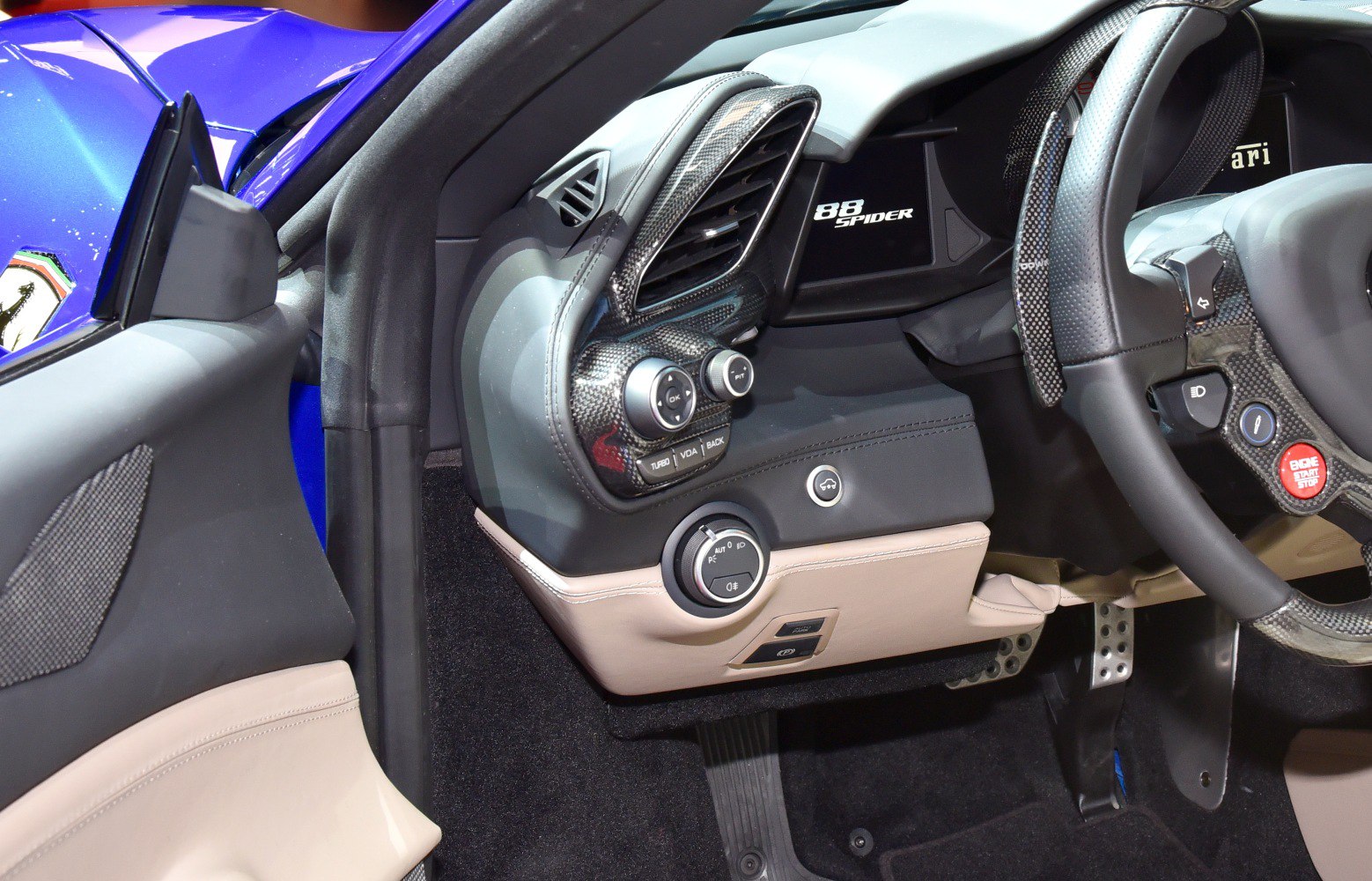 Dashboard and steering wheel controls with carbon fiber trim