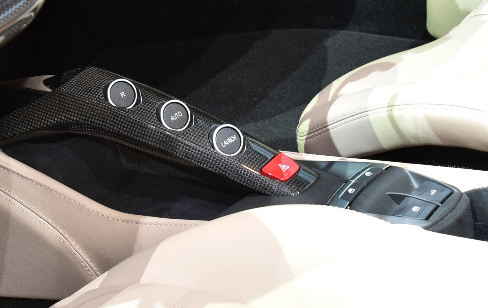 Center console controls with carbon fiber trim and buttons