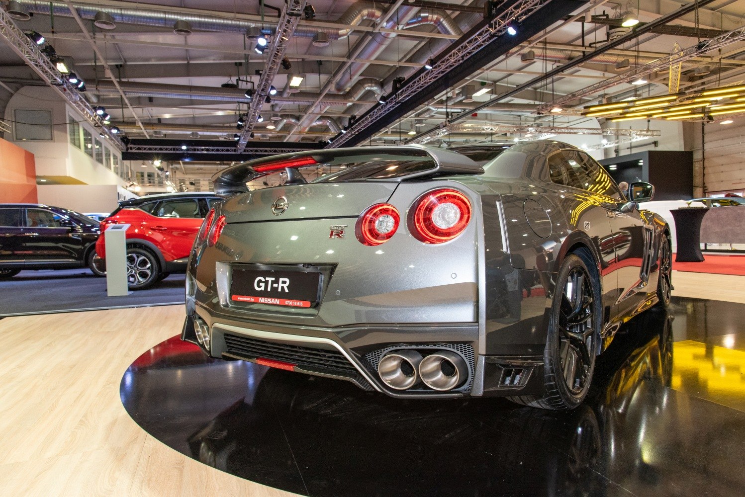 Quad round taillights and quad exhaust pipes on a sporty rear design