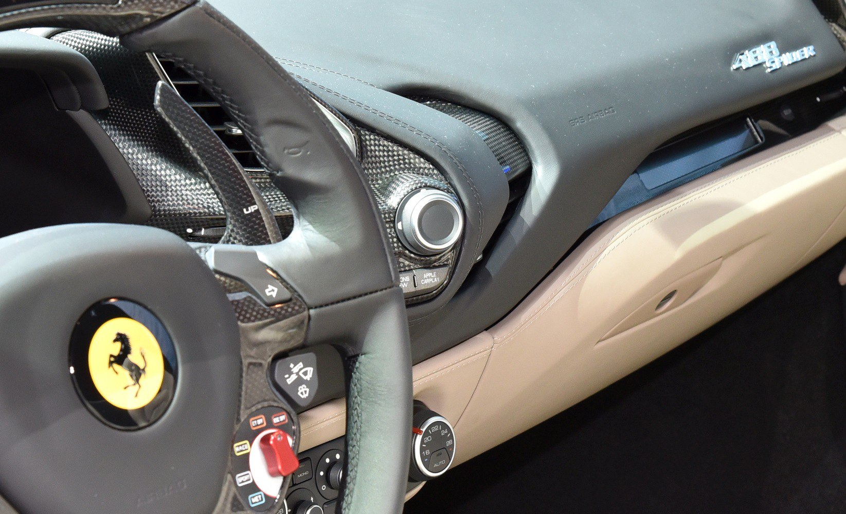 Dashboard and steering wheel with carbon fiber trim and control features
