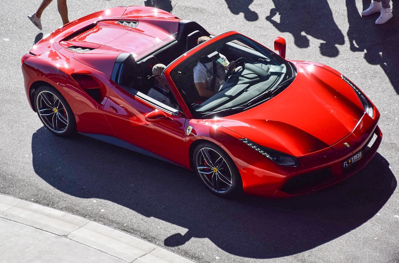 Red convertible sports car with aerodynamic design and open top