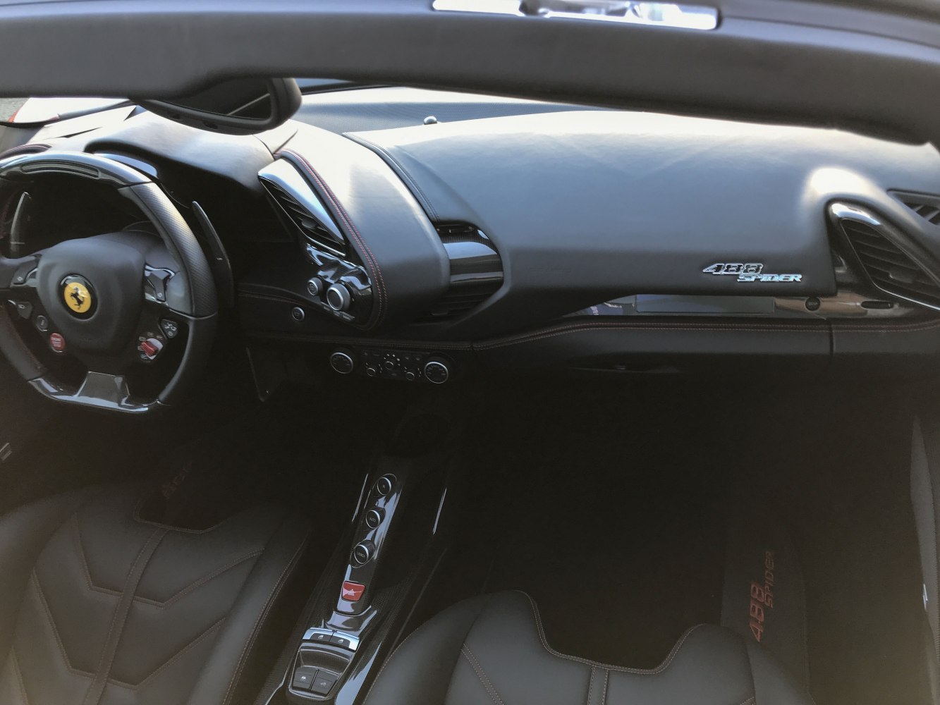 Premium sports car interior dashboard and steering wheel interior close-up