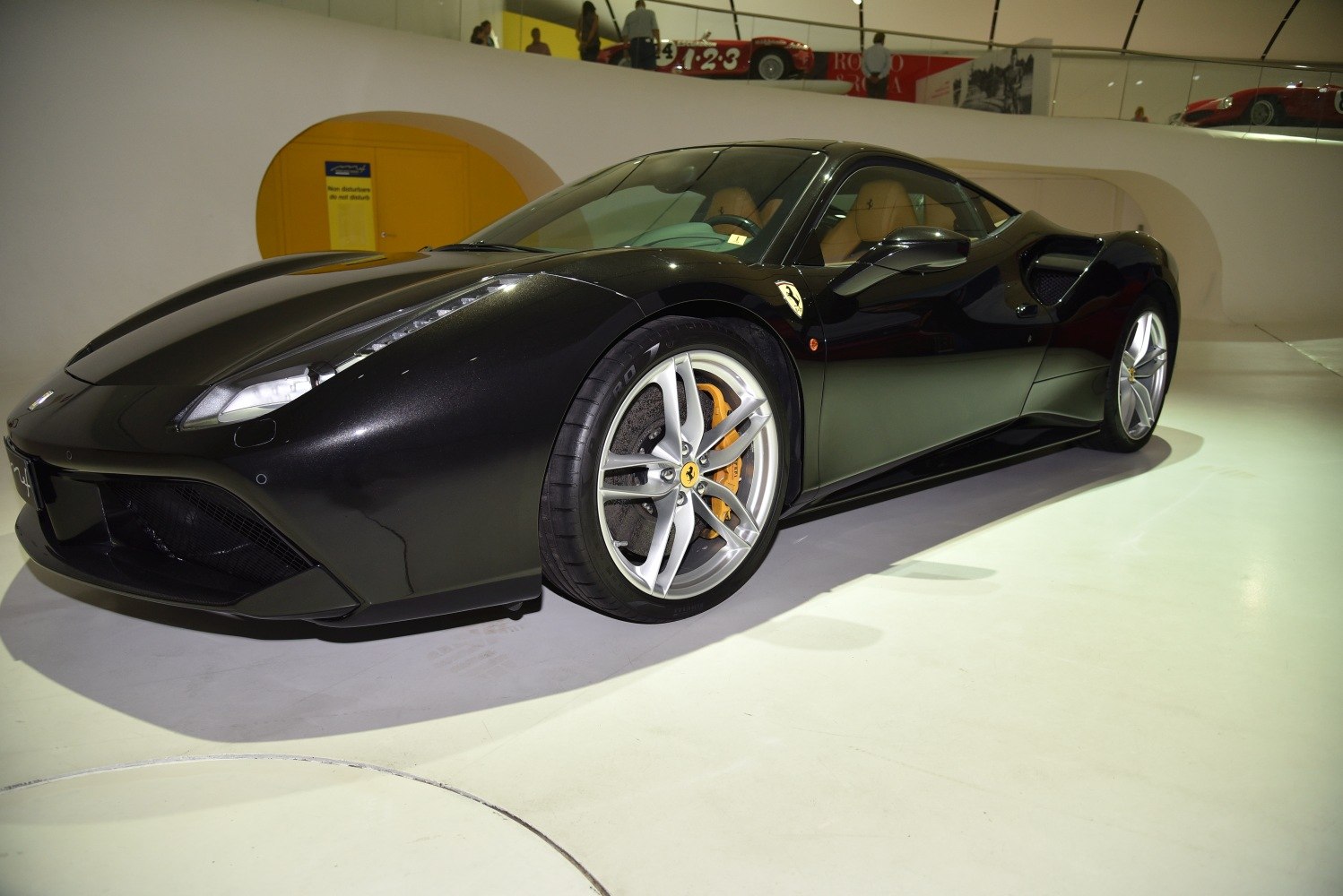 Mid-engine sports coupe with aerodynamic shape and alloy wheels