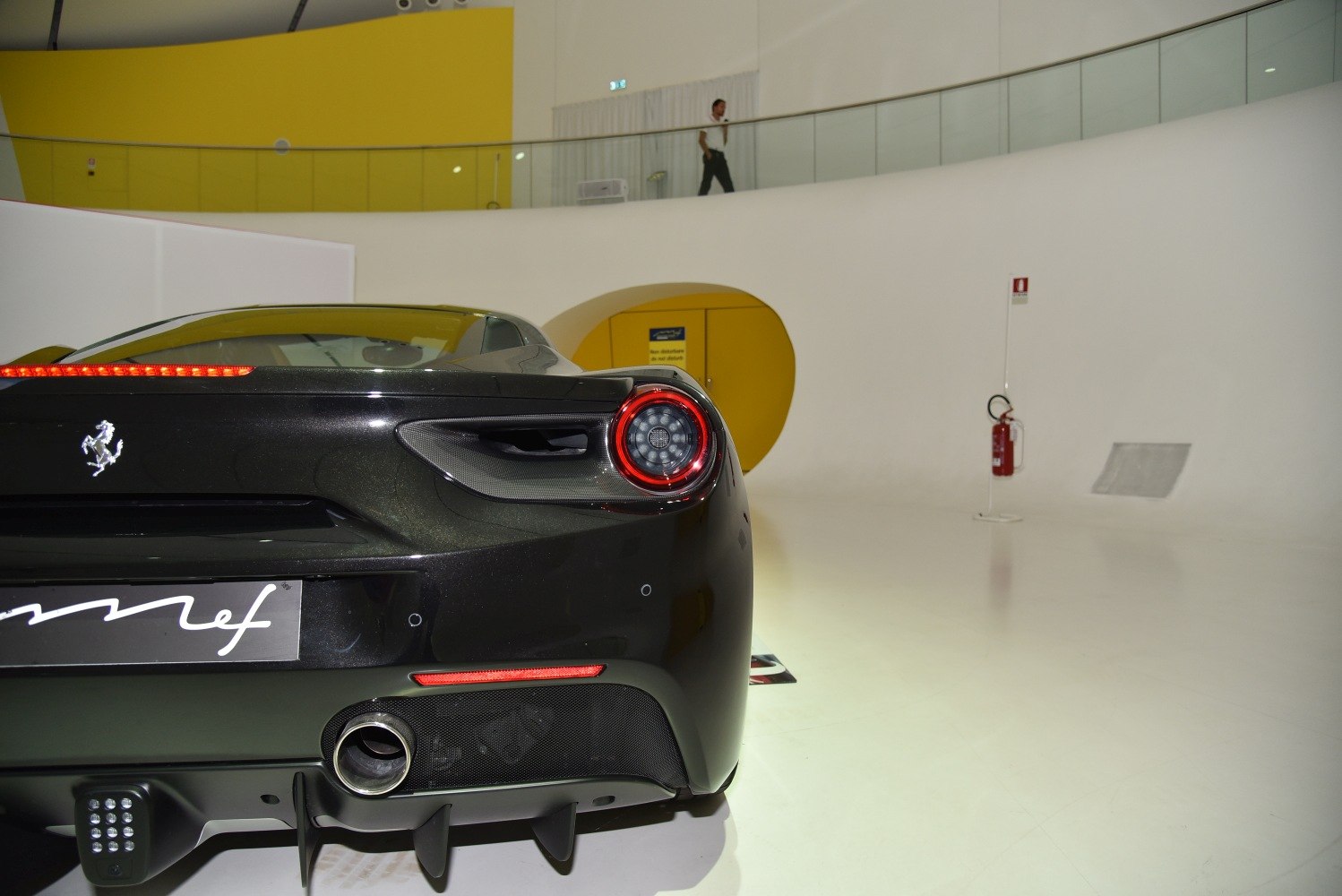 Rear taillight and exhaust of a sleek sports car