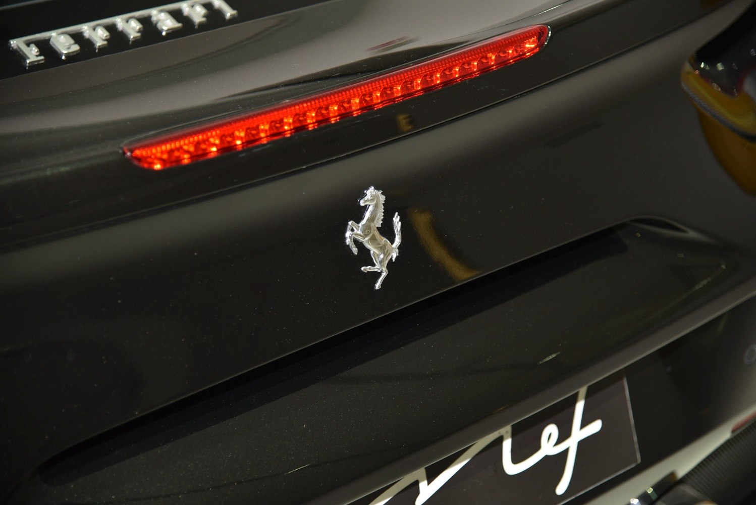 Close-up of rear emblem and LED strip taillight