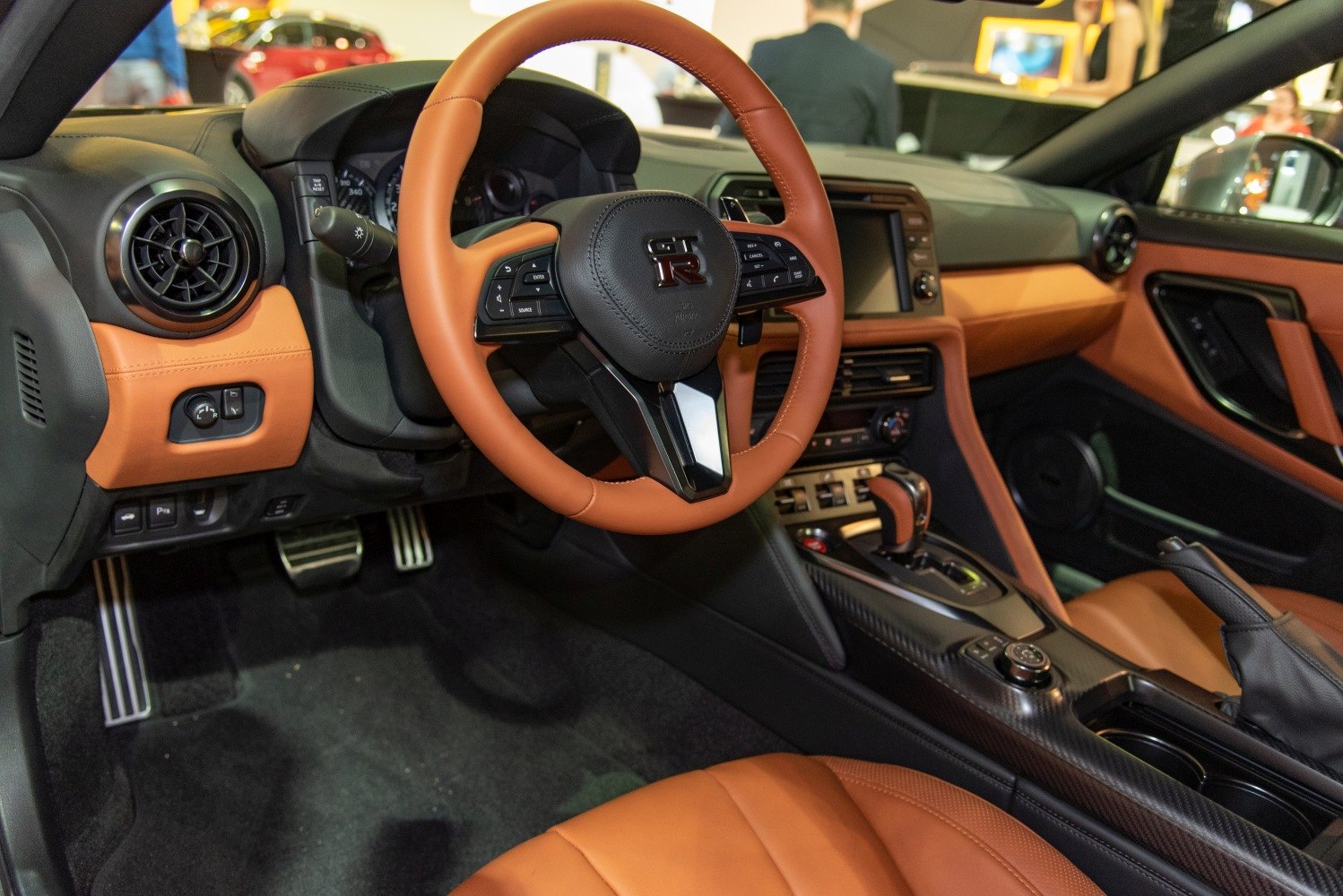 Steering wheel, dashboard, and premium seats of a sports car interior