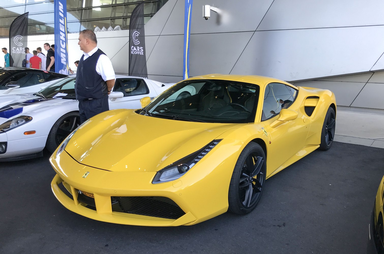 Yellow sports coupe with aerodynamic front and black wheels