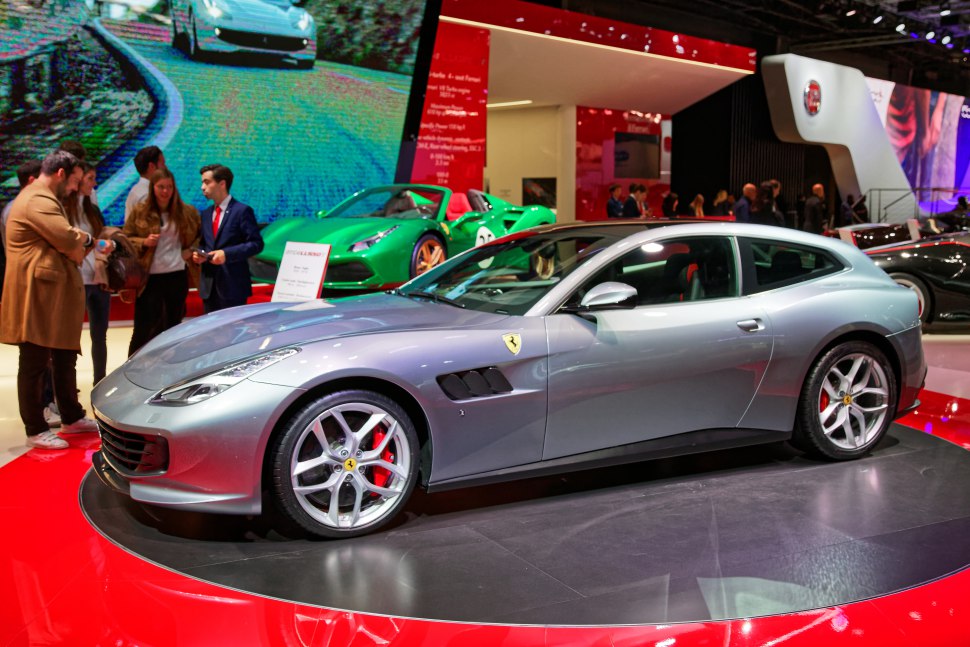 Silver luxury sports wagon with aerodynamic shape and red brake calipers