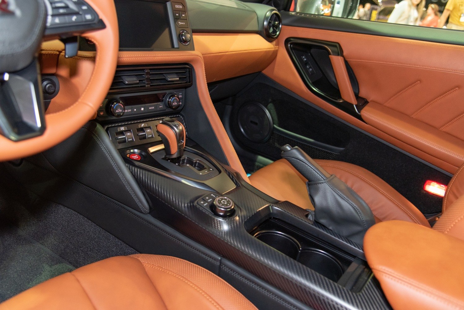 Leather seats and carbon fiber center console with modern automatic gear shifter