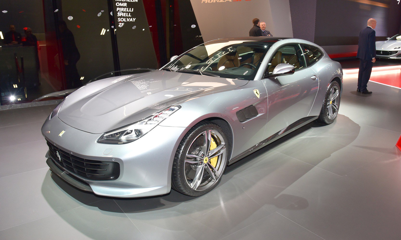 Silver sporty coupe with front vents and alloy wheels