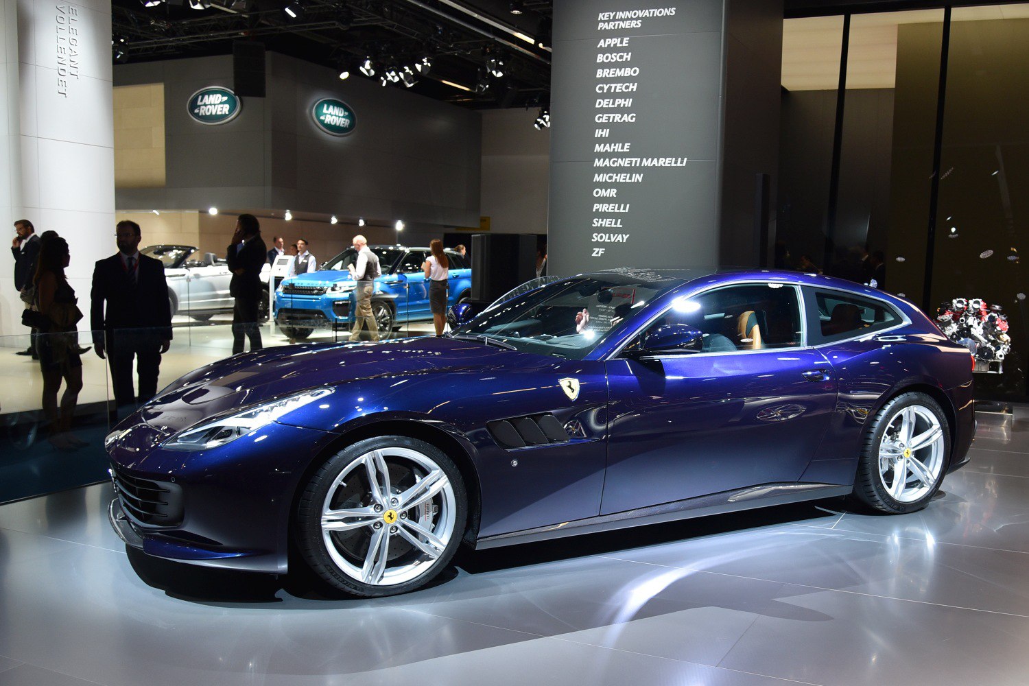 Luxury blue shooting brake with silver alloy wheels and aerodynamic body