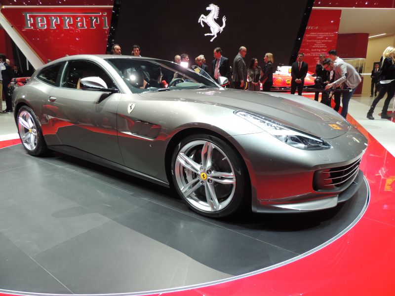 Silver sports coupe with aerodynamic shape and five-spoke alloy wheels