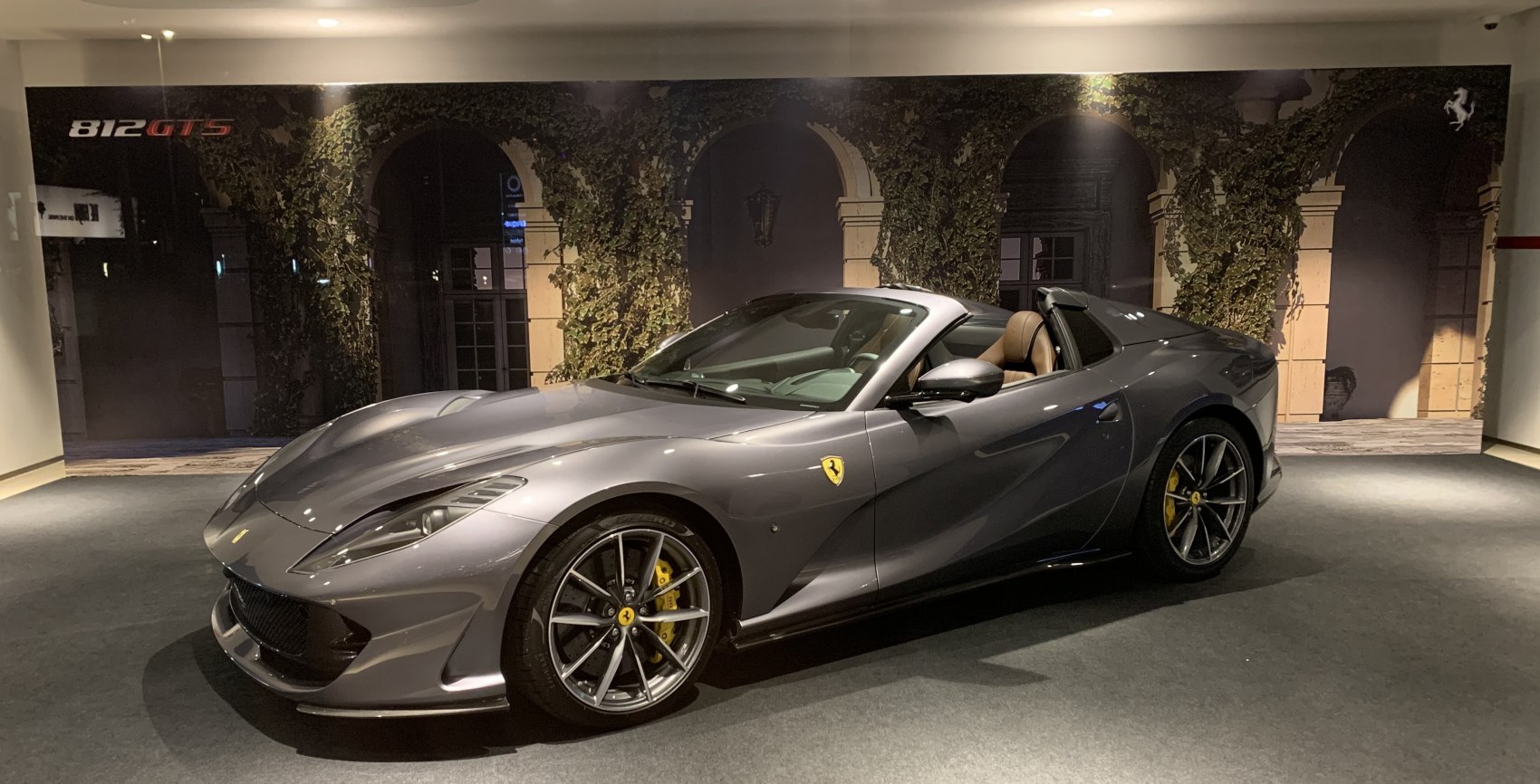 Convertible sports car with aerodynamic body and alloy wheels