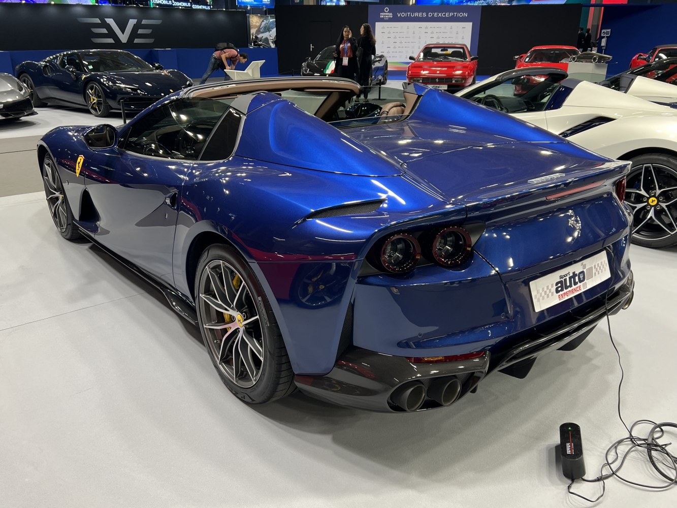 Convertible sports car rear with quad tail lights and dual exhausts