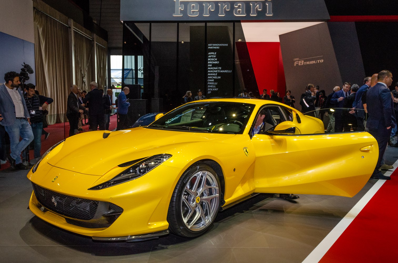 Yellow sports coupe with aerodynamic design and open driver door