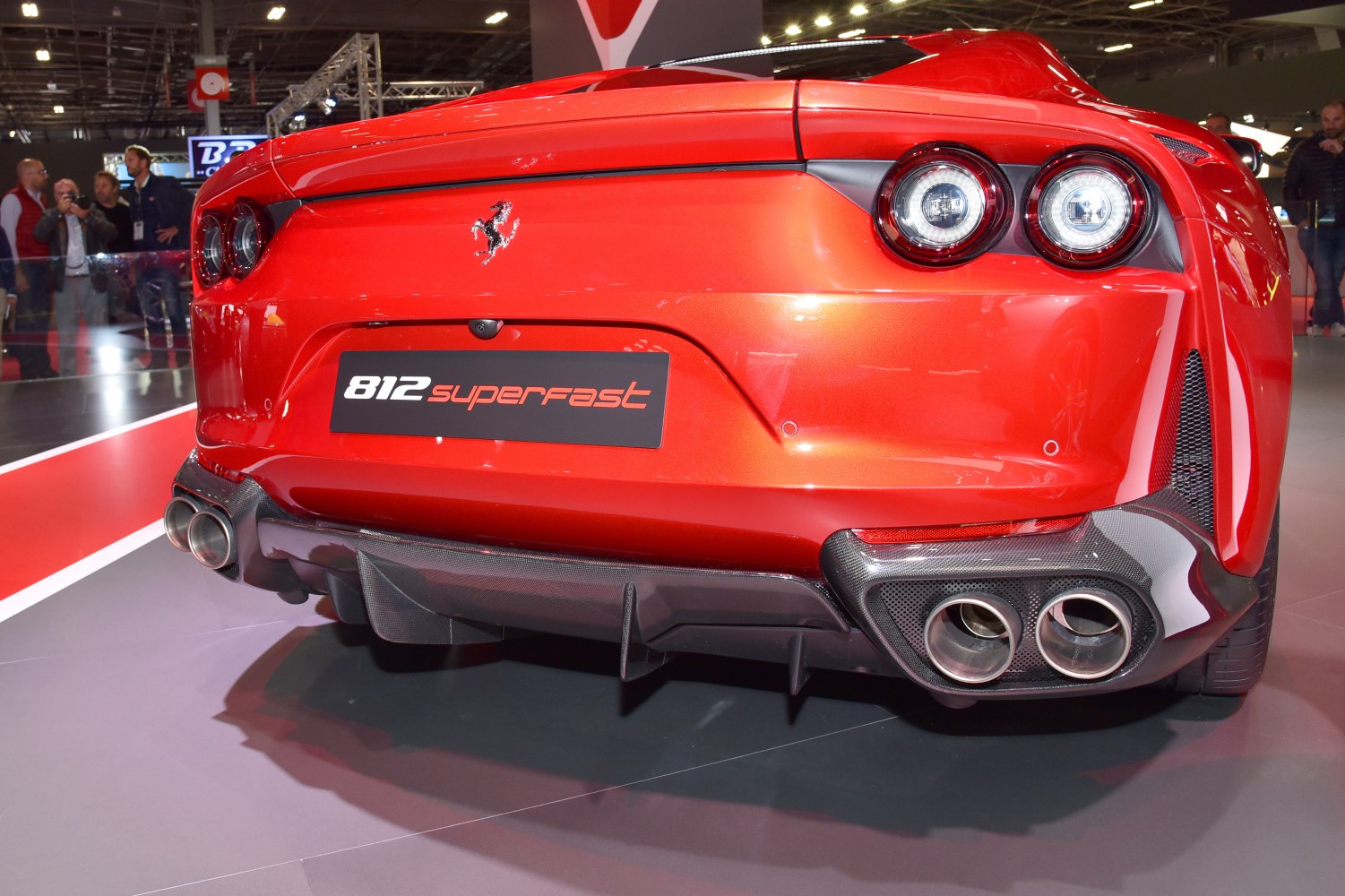 Rear view with quad exhaust tips and circular tail lights