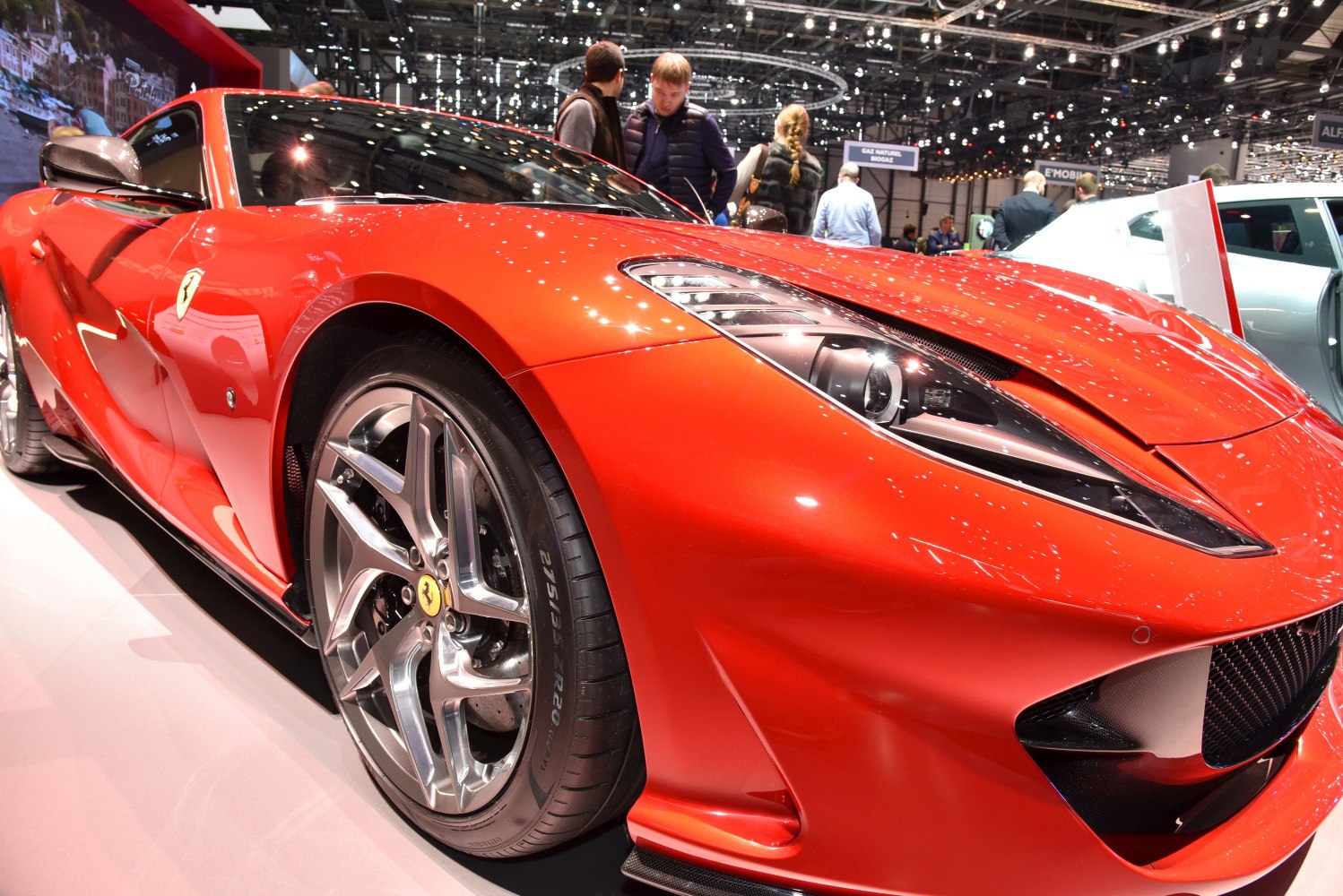 Close-up of front end, headlight, and alloy wheel