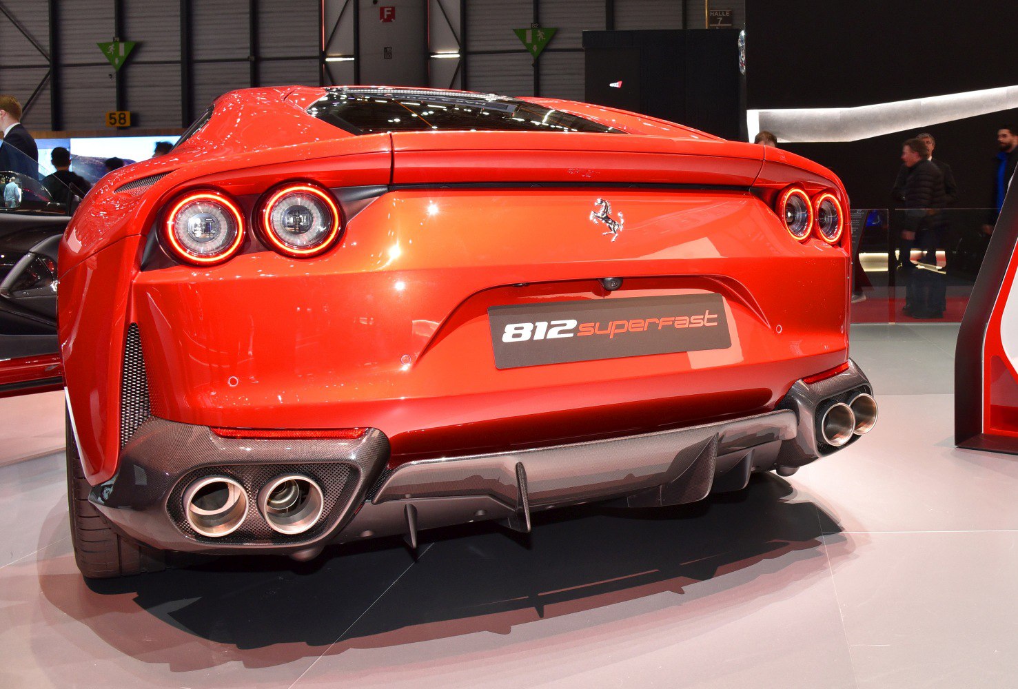 Rear view of sports car with quad exhausts and circular taillights