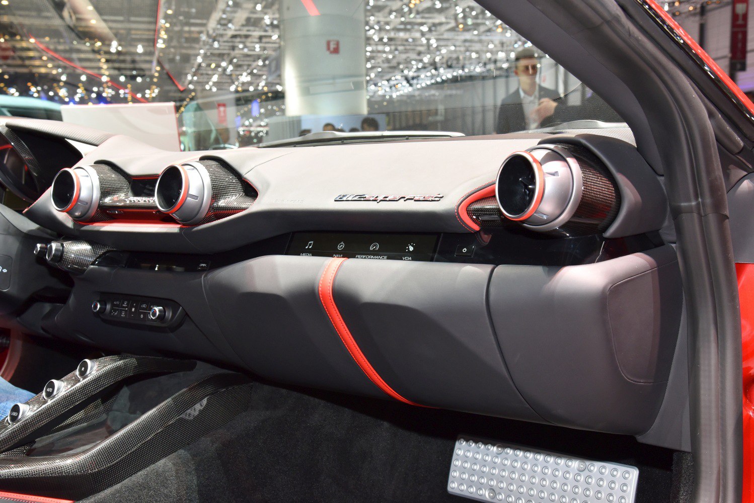 Luxury car dashboard with round air vents and sleek design
