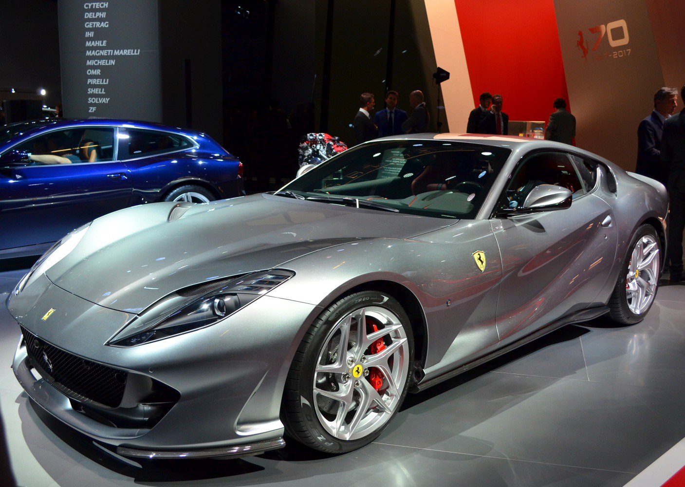 Aerodynamic front side view with sleek body and red brake calipers