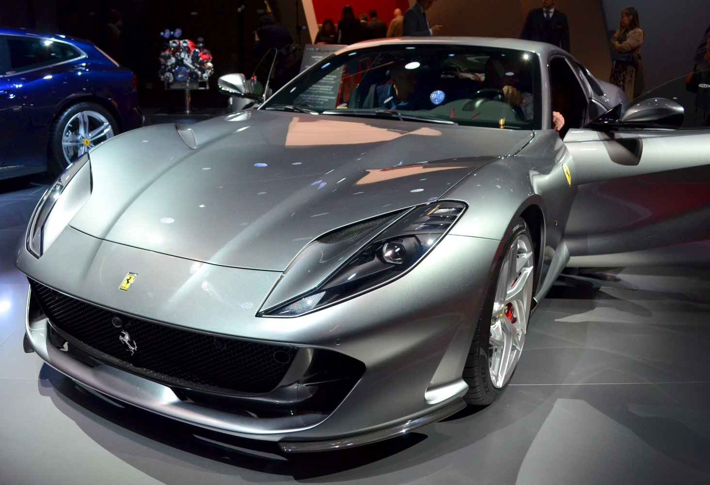 Front-side view with distinctive headlights and open door