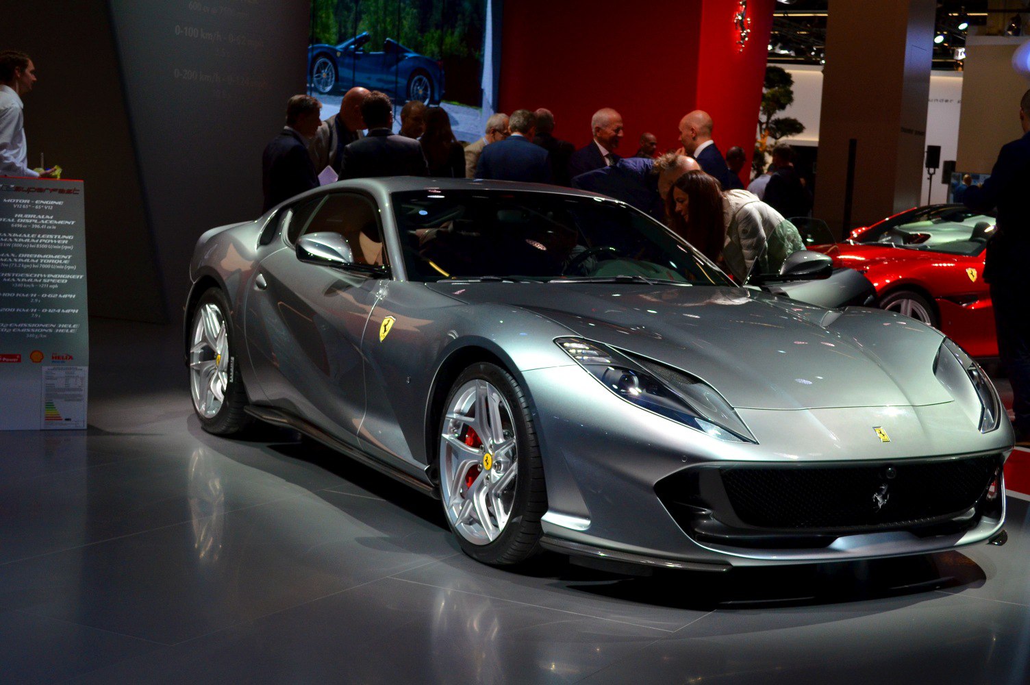 Silver luxury coupe with aerodynamic design and Ferrari badge
