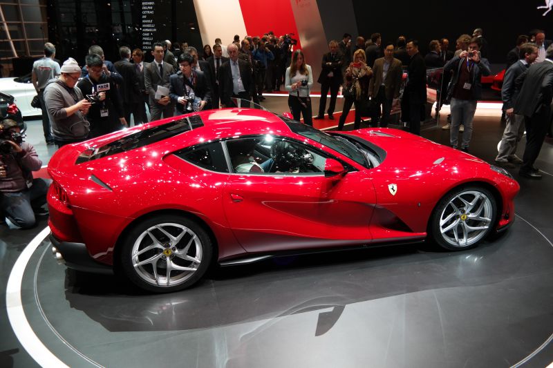 Sleek side profile of a luxury sports coupe with aerodynamic design and alloy wheels.