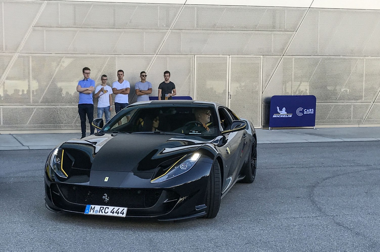 Front view of a sleek sports car with LED headlights and aerodynamic styling.