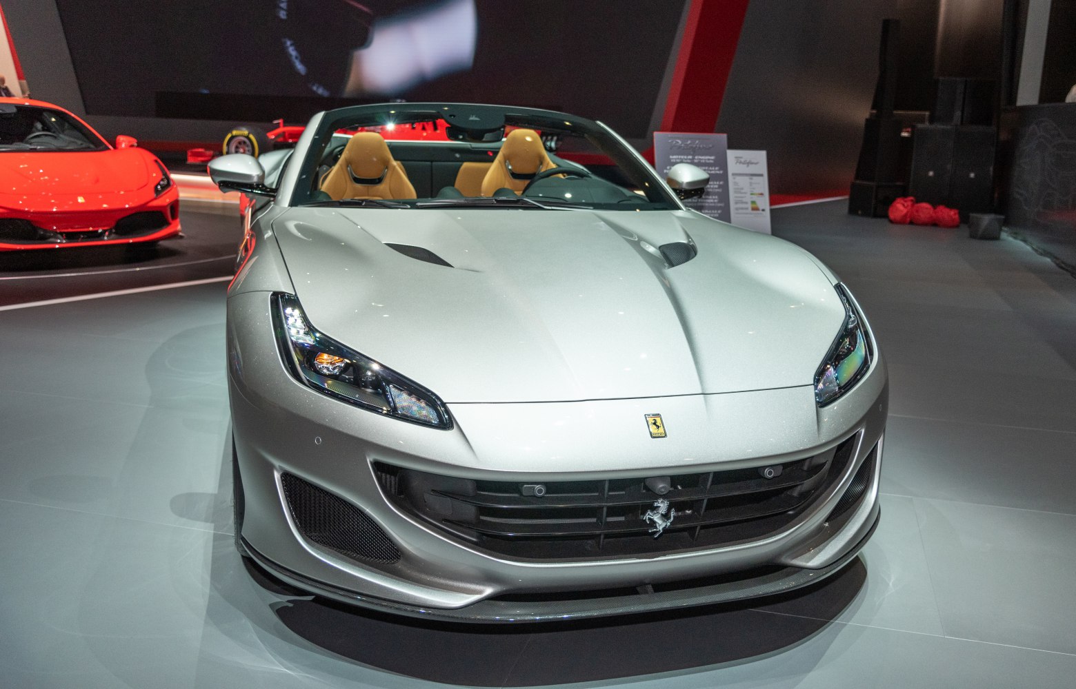 Front view of a sleek convertible with modern headlights and grille