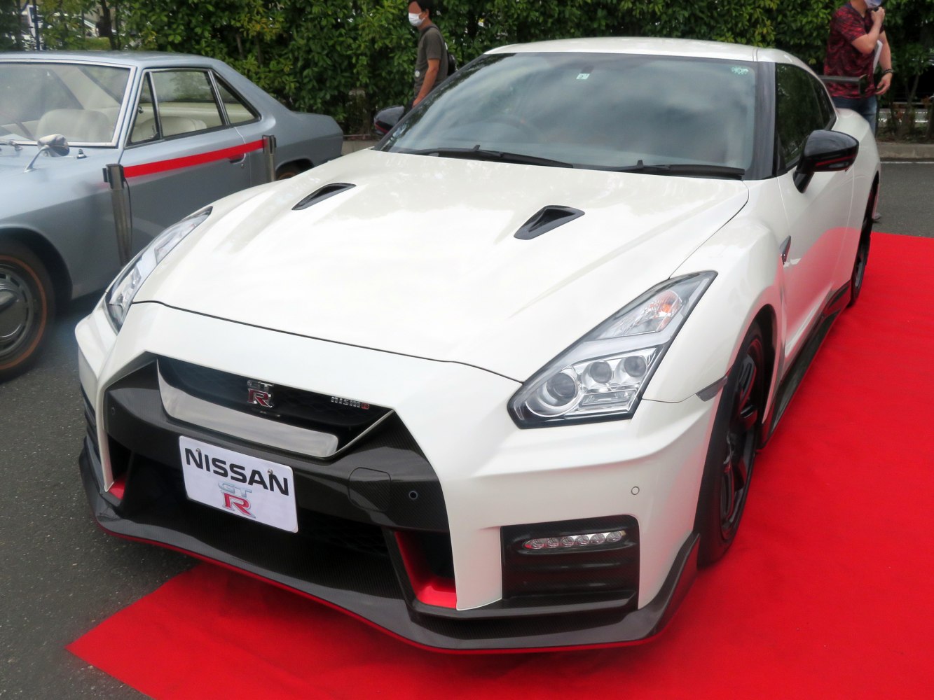 Aggressive front end with dual hood vents and sleek headlights.