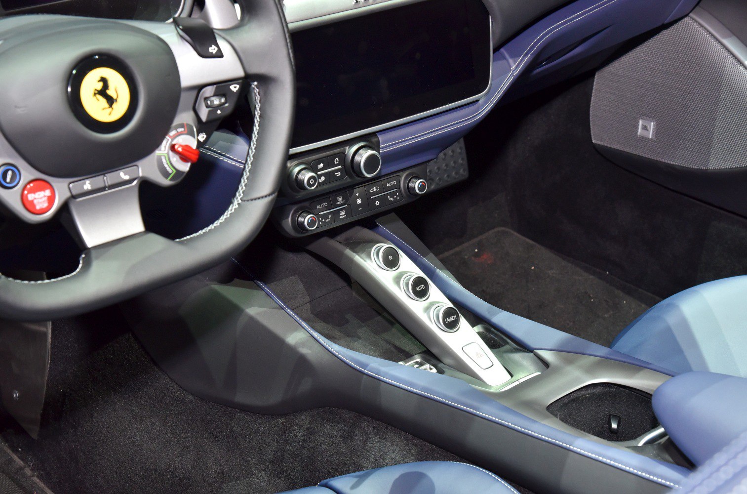 Sport steering wheel and advanced center console controls in luxury car interior
