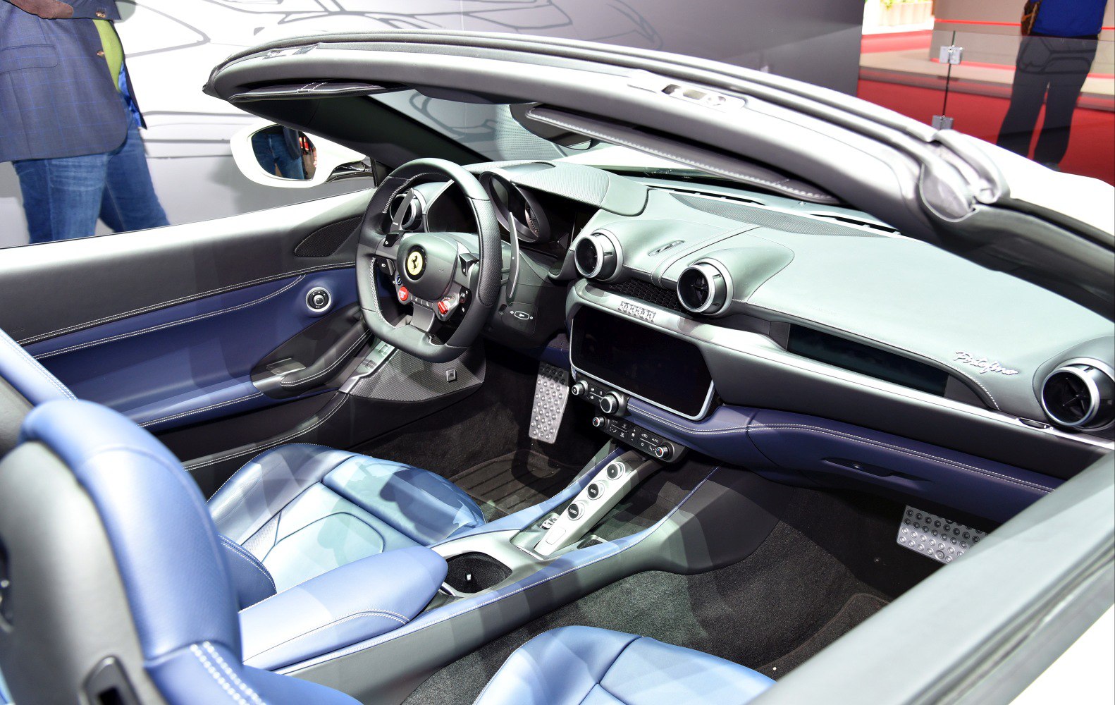 Convertible interior with advanced dashboard and blue leather seats