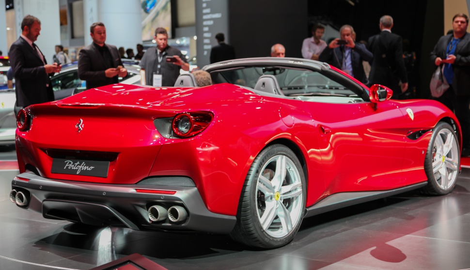 Red convertible rear view with quad exhaust and sporty wheels