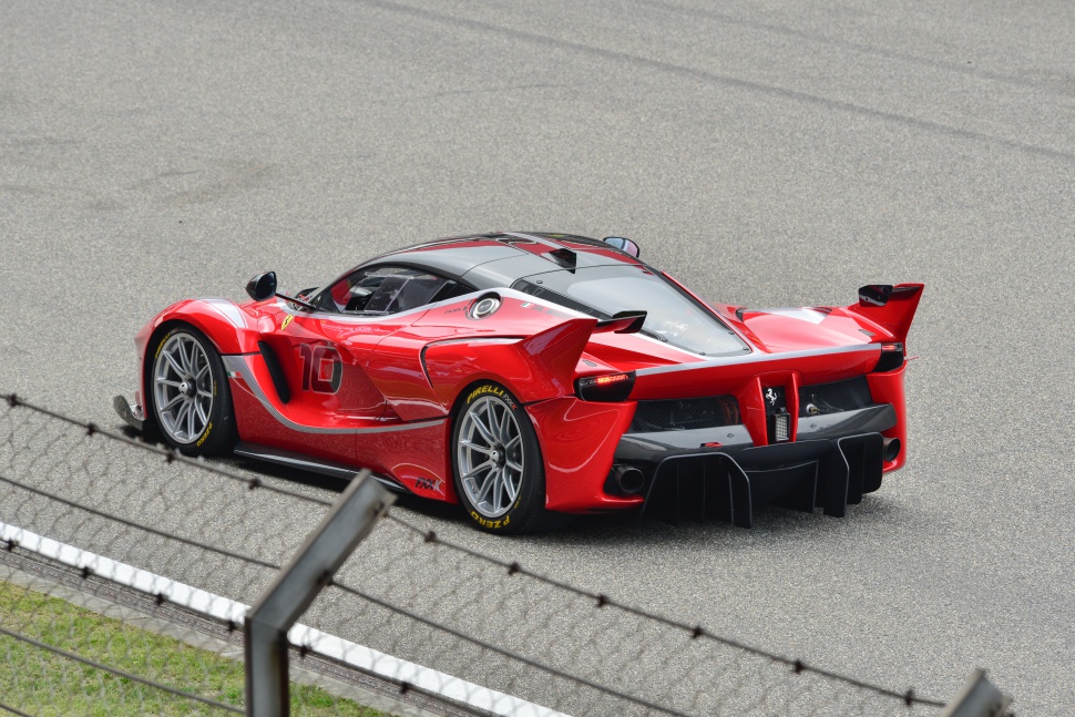 Rear view of a high-performance racing car with aerodynamic rear wing and diffuser
