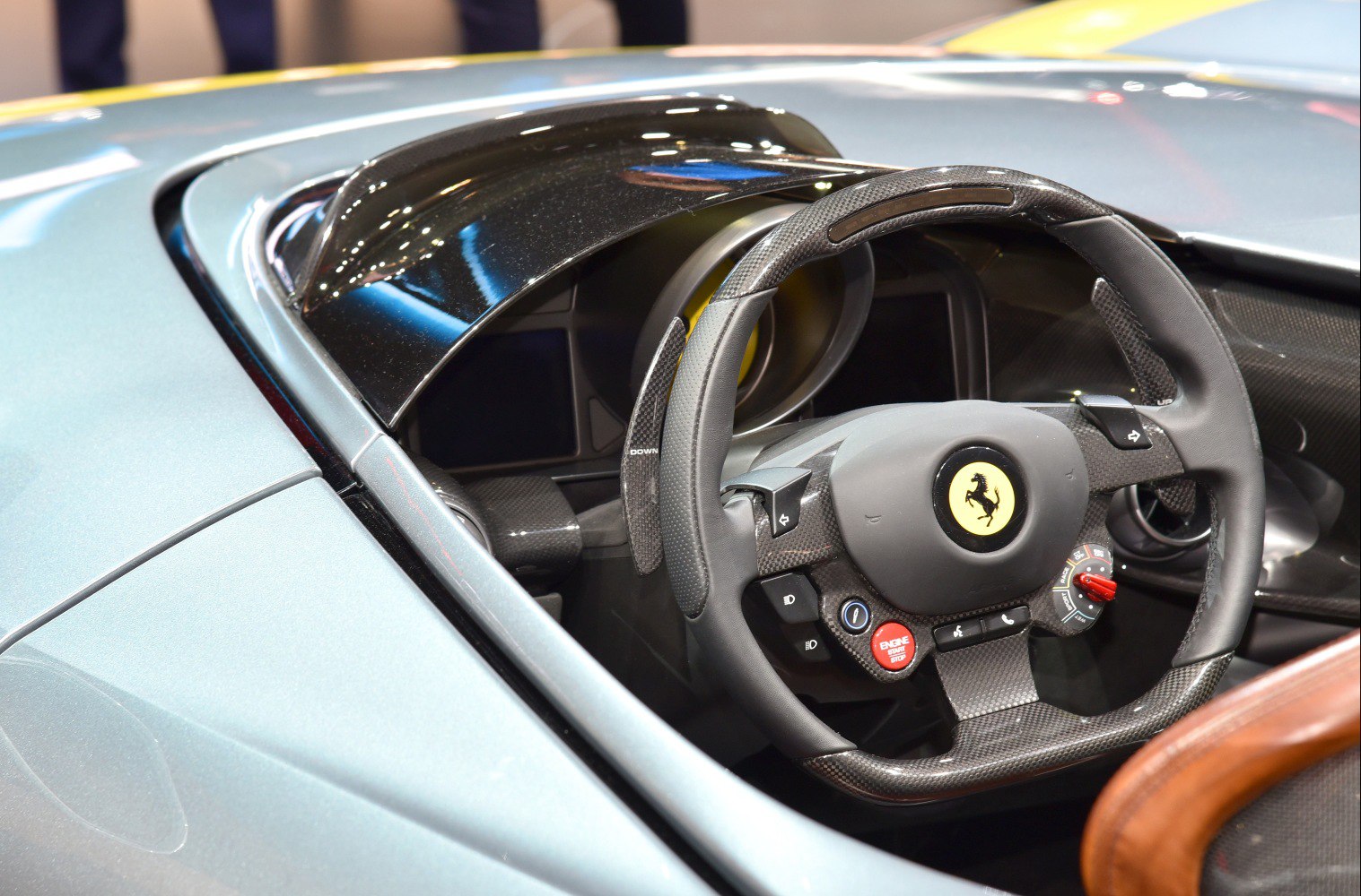 Carbon fiber steering wheel and cockpit view with racing controls