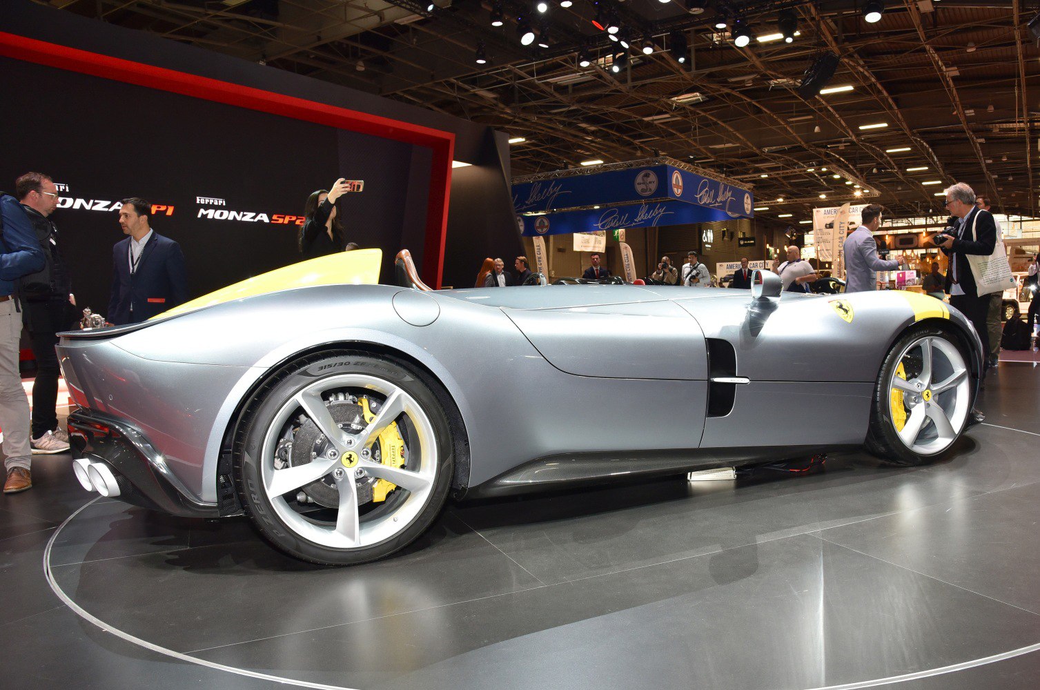 Aerodynamic rear design with yellow brake calipers and dual exhausts