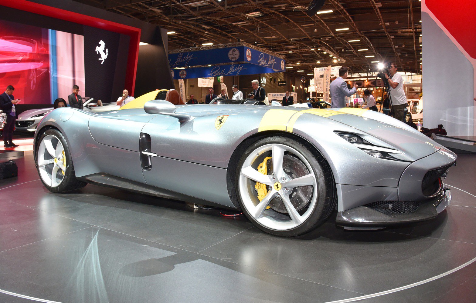 Sleek open cockpit sportscar with aerodynamic curves and large wheels