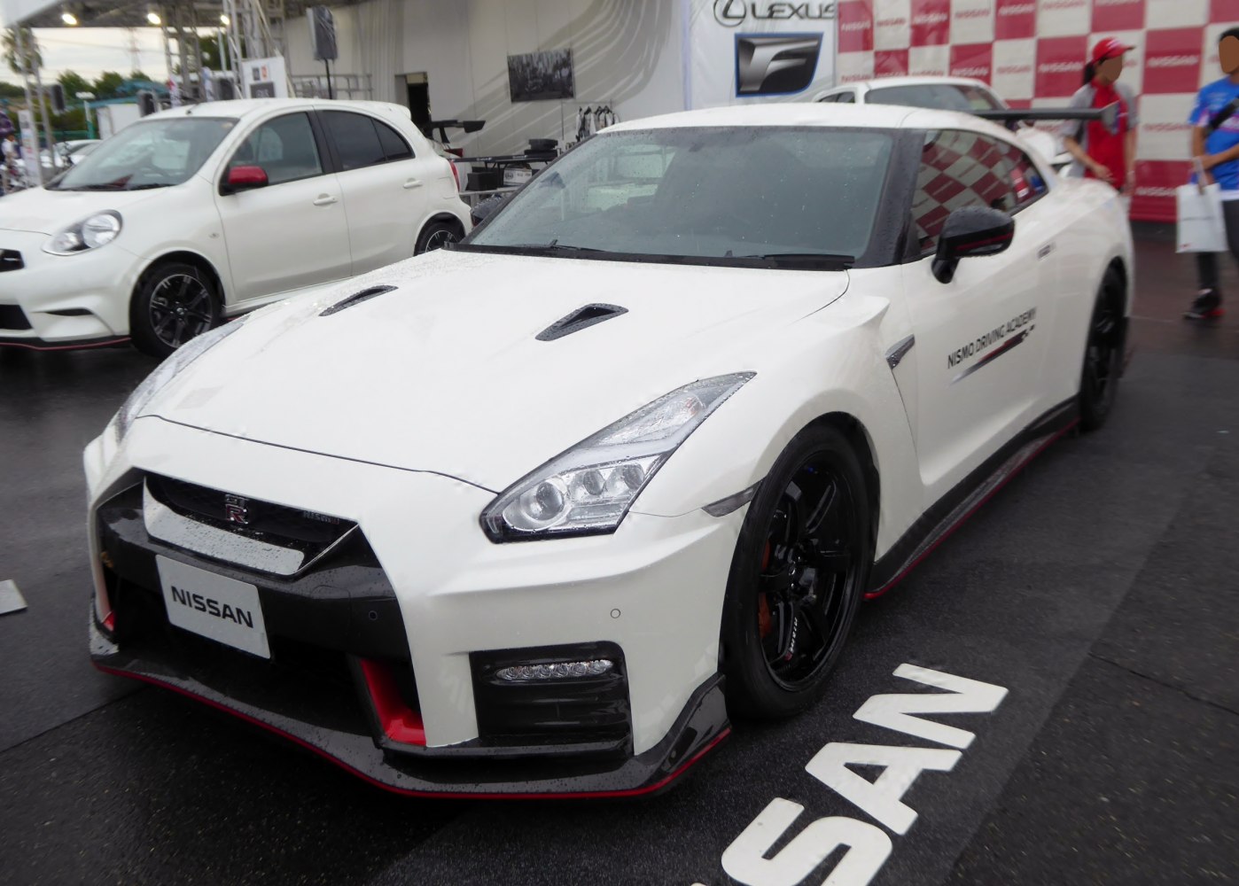 White Nissan GT-R front view with aerodynamic vents and sporty wheels