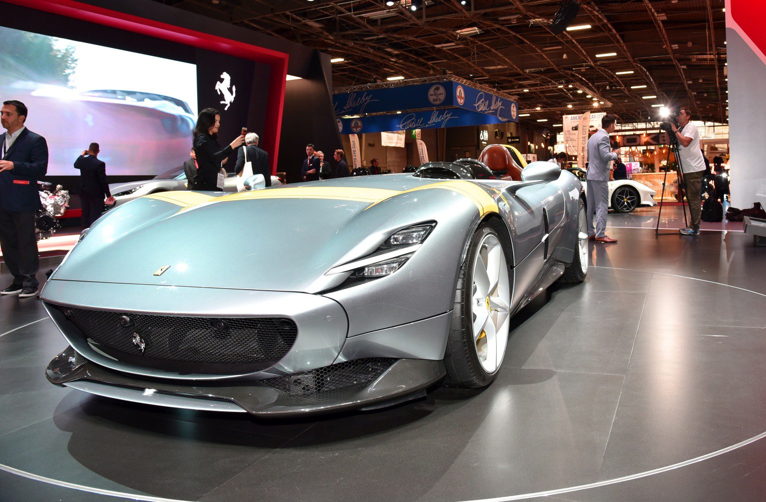 Front view of a sleek roadster with retro styling and aggressive headlights
