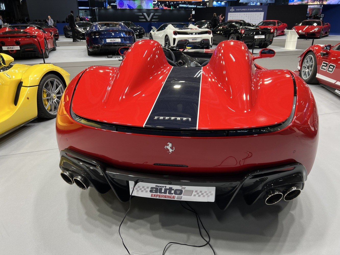 Rear view with dual exhaust pipes and aerodynamic twin hump design