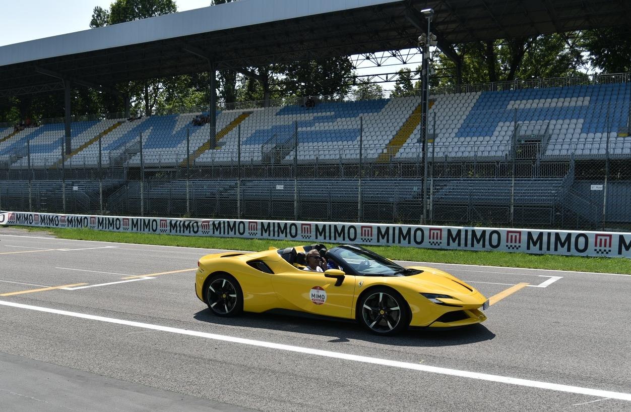 Yellow convertible sports car with aerodynamic body and alloy wheels
