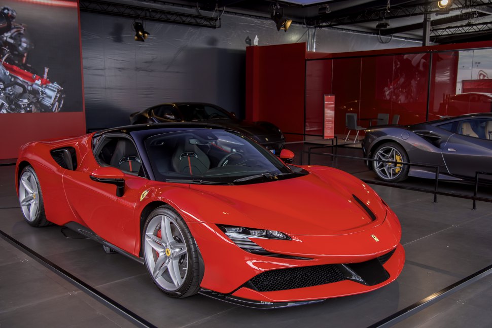 Red Ferrari SF90 Stradale front three-quarter view with aerodynamic design