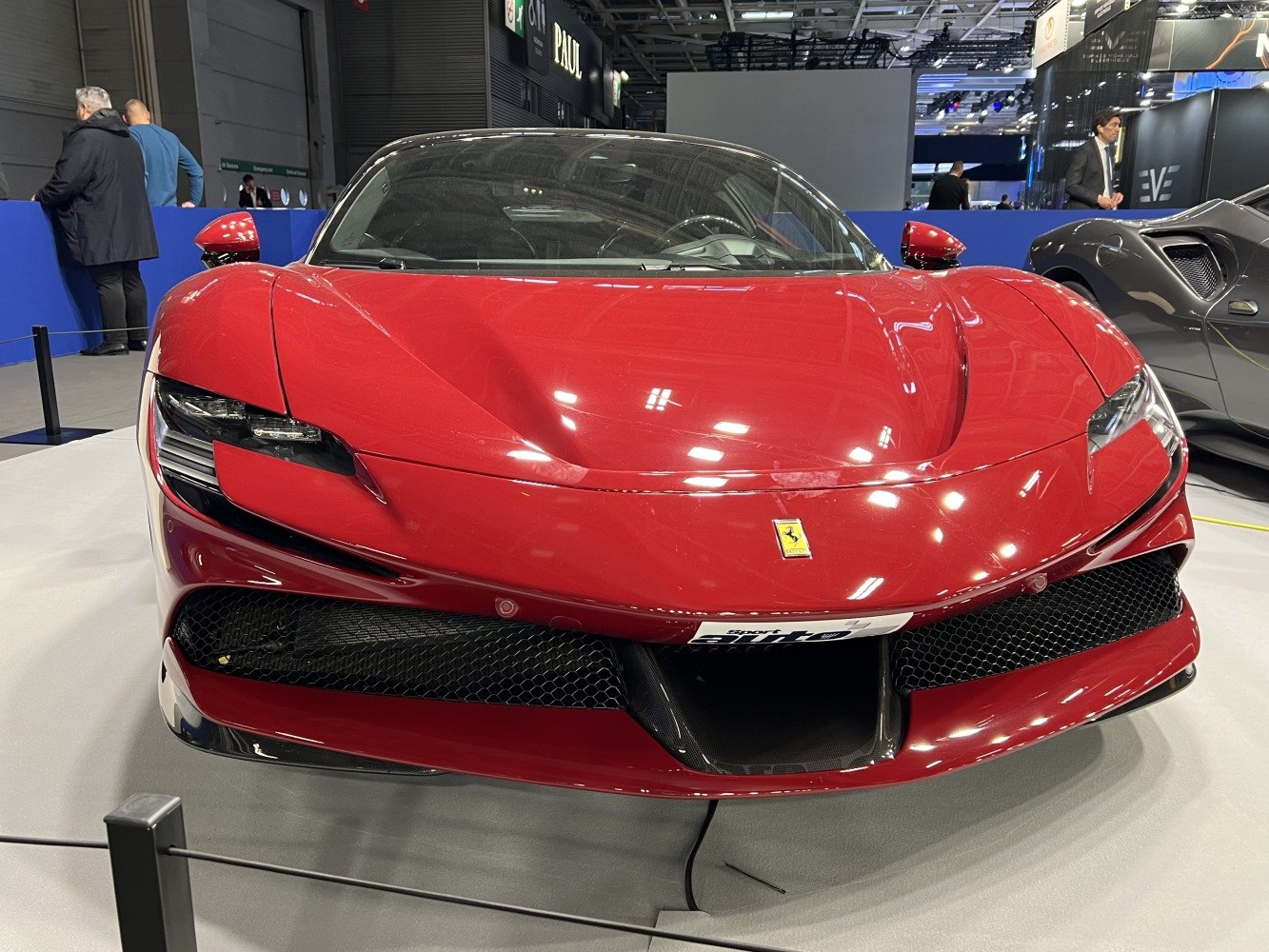 Front view of an aerodynamic sports car with aggressive headlights